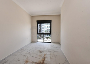 شقة 1+1 في مجمع جديد بدون بنية تحتية في منطقة محمودلار