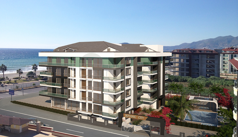 شقة بتخطيط5+1 في أحد المجمعات الفاخرة على الخط الأول من البحر في منطقة كاستل – ألانيا