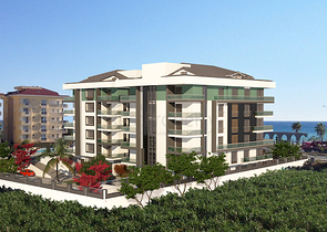 شقة بتخطيط5+1 في أحد المجمعات الفاخرة على الخط الأول من البحر في منطقة كاستل – ألانيا