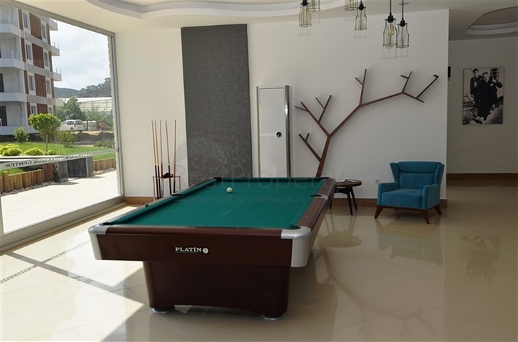 سعر مناسب - بين احضان الطبيعة -دوبلكس 2 غرفة وصالة -ضمن مجمع - في ديمرتاش / الانيا 