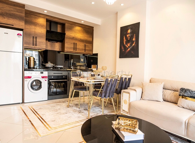 ضمن مجمع حديث يضم كافة الخدمات -شقة 1+1 - في مهموتلار / الانيا 