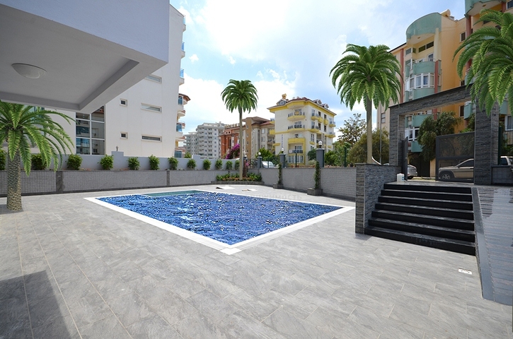 تصميم عصري وحديث - شقة غرفة وصالة مفروشة ضمن مجمع سكني في اوبا / الانيا 