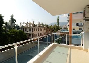 شقة بتخطيط 1+1 في منطقة توسمور – ألانيا