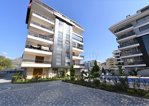 شقق ضمن مجمع سكني حديث على مقربة من البحر قيد الإنشاء في منطقة كاستل – ألانيا