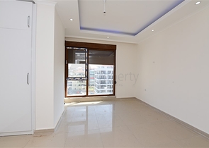 شقق ضمن مجمع سكني حديث على مقربة من البحر قيد الإنشاء في منطقة كاستل – ألانيا