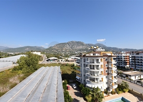 شقق ضمن مجمع سكني حديث على مقربة من البحر قيد الإنشاء في منطقة كاستل – ألانيا