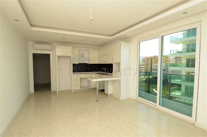 شقة بتخطيط 2+1 ضمن مجمع حديث في منطقة محمودلار – ألانيا