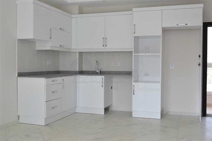 شقة بتخطيط 1+1 في وسط محمودلار – ألانيا