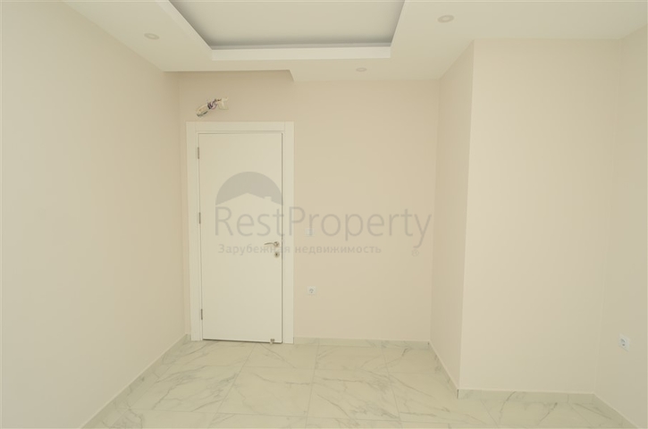 شقة بتخطيط 2+1 ضمن مجمع حديث في منطقة محمودلار – ألانيا