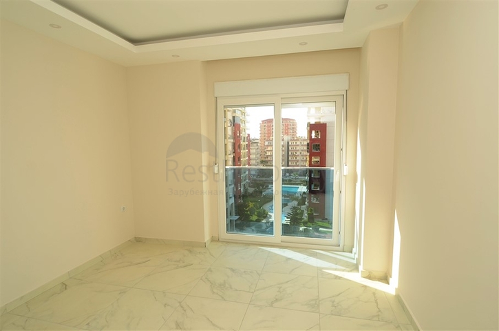 شقة بتخطيط 2+1 ضمن مجمع حديث في منطقة محمودلار – ألانيا