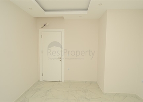 شقة بتخطيط 2+1 ضمن مجمع حديث في منطقة محمودلار – ألانيا