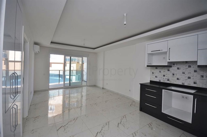 شقة بتخطيط 1+1 ضمن مجمع مميز في منطقة محمودلار – ألانيا