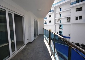 شقة بتخطيط 1+1 ضمن مجمع مميز في منطقة محمودلار – ألانيا