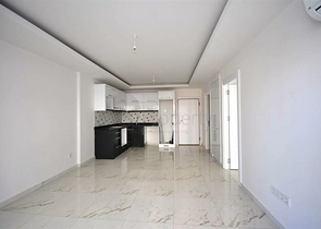 شقة بتخطيط 1+1 ضمن مجمع مميز في منطقة محمودلار – ألانيا