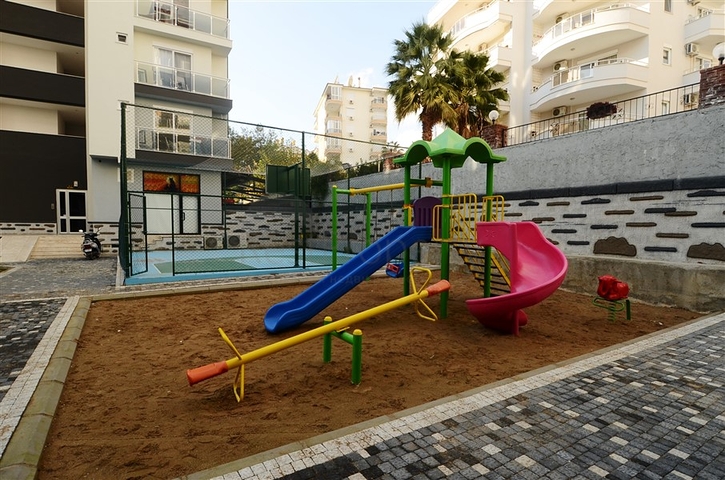 شقة بتخطيط 1+1 ضمن مجمع سكني في منطقة جيكجيلي – ألانيا