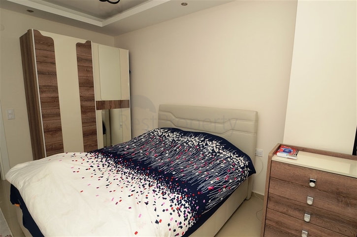 شقة بتخطيط 1+1 ضمن مجمع سكني في منطقة جيكجيلي – ألانيا