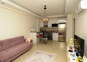 شقة بتخطيط 1+1 ضمن مجمع سكني في منطقة جيكجيلي – ألانيا