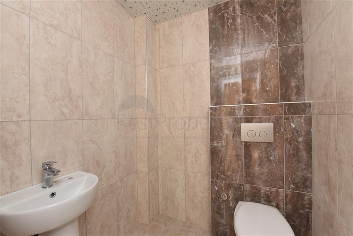 شقة جديدة - تصميم 2 غرفة وصالة -مطبخ منفصل -في مركز الانيا 