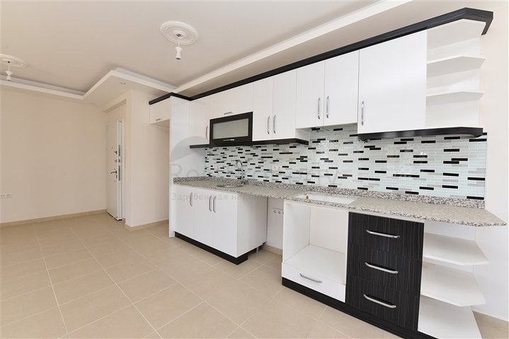 طابق مرتفع -شقة عائلية 1+2- بدون فرش - مجمع انيق - في مهموتلار / الانيا 