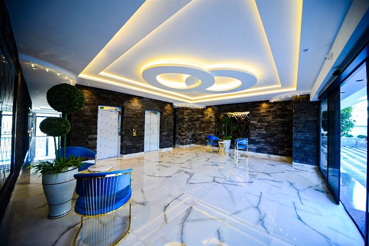 شقة غرفة وصالة - ضمن مجمع سكني حديث قريب من البحر - في مهموتلار / الانيا 