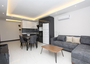 موقع مميز -مجمع سكني جديد -شقة غرفة وصالة في مركز الانيا 