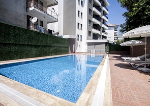 موقع مميز -مجمع سكني جديد -شقة غرفة وصالة في مركز الانيا 