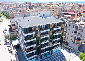 موقع مميز -مجمع سكني جديد -شقة غرفة وصالة في مركز الانيا 