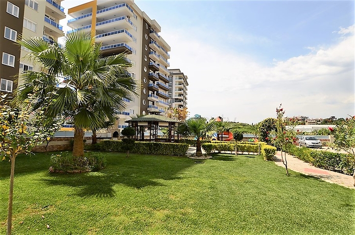 شقة 1+1 غرفة وصالة - في مجمع يضم كافة الخدمات -في مهموتلار / الانيا 