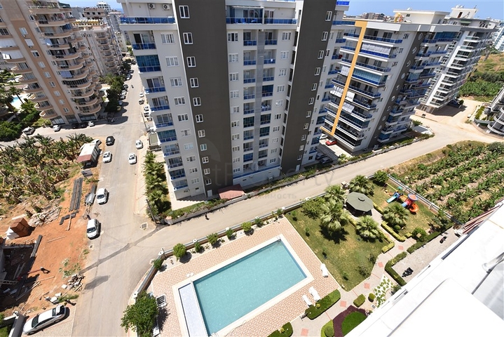 شقة 1+1 غرفة وصالة - في مجمع يضم كافة الخدمات -في مهموتلار / الانيا 