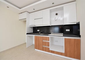 شقة 1+1 غرفة وصالة - في مجمع يضم كافة الخدمات -في مهموتلار / الانيا 