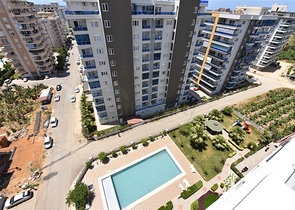 شقة 1+1 غرفة وصالة - في مجمع يضم كافة الخدمات -في مهموتلار / الانيا 