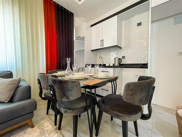 شقة غرفة وصالة  مفروشة بأناقة -ضمن مجمع سكني -في مهموتلار / الانيا 