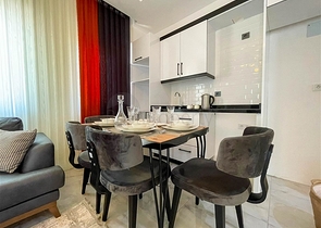 شقة غرفة وصالة  مفروشة بأناقة -ضمن مجمع سكني -في مهموتلار / الانيا 