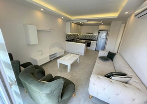 شقة غرفة وصالة -ضمن مجمع سكني - قريب من البحر والخدمات -في مهموتلار / الانيا 