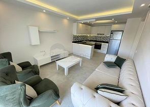 شقة غرفة وصالة -ضمن مجمع سكني - قريب من البحر والخدمات -في مهموتلار / الانيا 