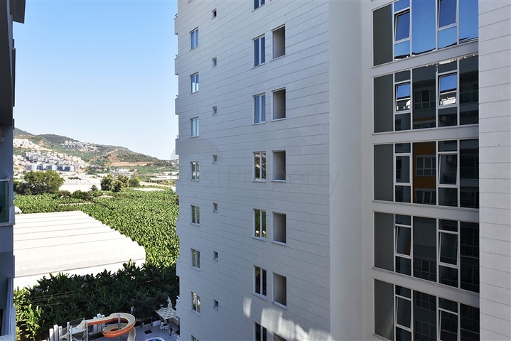 شقة مفروشة -تصميم 1+1 -ضمن مجمع سكني -في مهموتلار / الانيا 