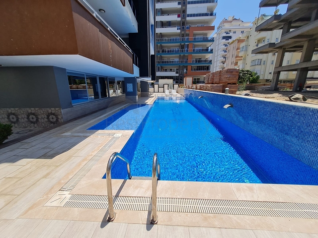 مجمع سكني حديث - شقة انيقة غرفة وصالة -مع الاثاث -في مهموتلار / الانيا 