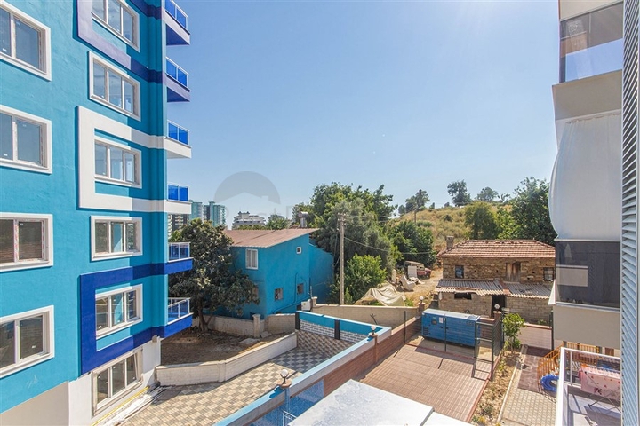 شقة غرفة وصالة -مجمع جديد - في مهموتلار / الانيا 