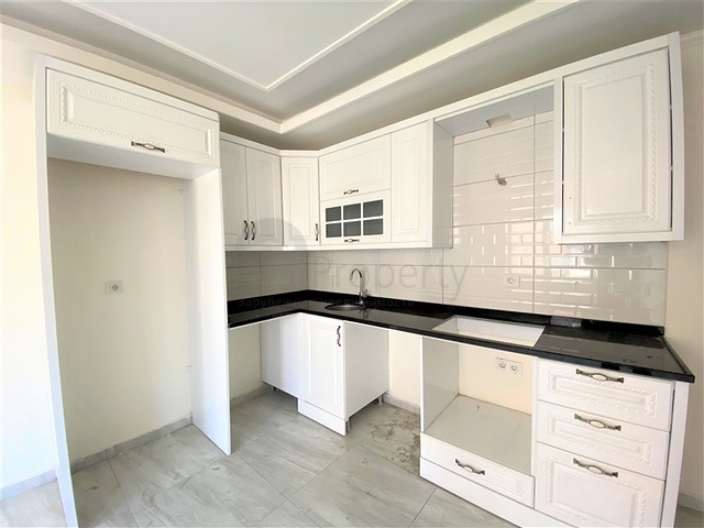 عقارات في الانيا - شقة جديدة من تصميم 1+1 - في مركز الانيا 