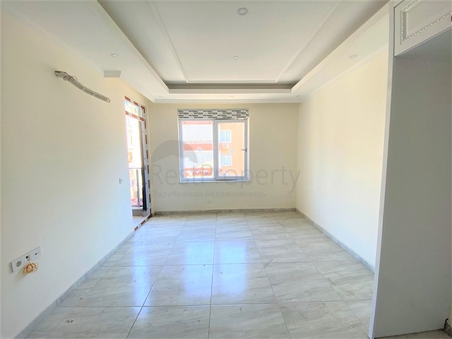 عقارات في الانيا - شقة جديدة من تصميم 1+1 - في مركز الانيا 