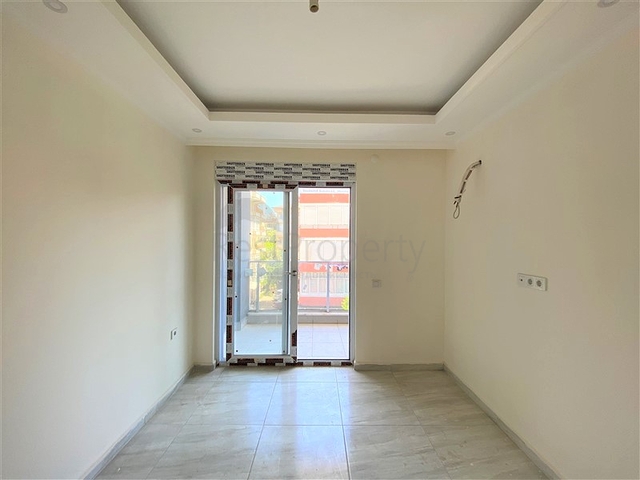 عقارات في الانيا - شقة جديدة من تصميم 1+1 - في مركز الانيا 