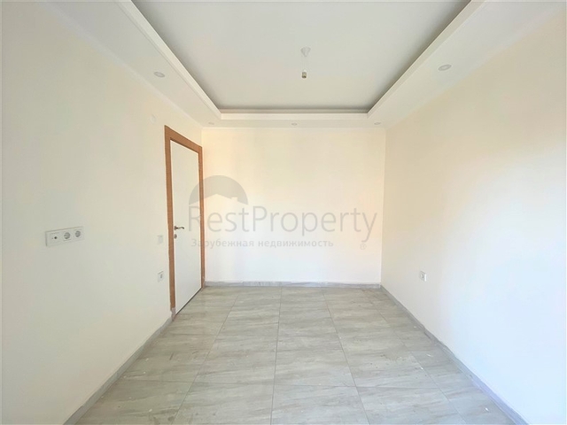 عقارات في الانيا - شقة جديدة من تصميم 1+1 - في مركز الانيا 