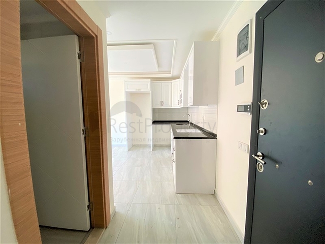 عقارات في الانيا - شقة جديدة من تصميم 1+1 - في مركز الانيا 