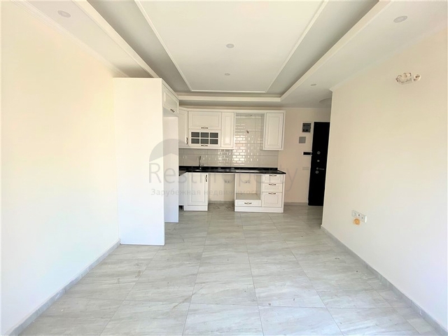 عقارات في الانيا - شقة جديدة من تصميم 1+1 - في مركز الانيا 