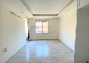 عقارات في الانيا - شقة جديدة من تصميم 1+1 - في مركز الانيا 