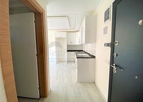 عقارات في الانيا - شقة جديدة من تصميم 1+1 - في مركز الانيا 