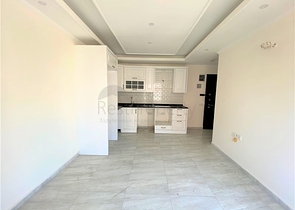 عقارات في الانيا - شقة جديدة من تصميم 1+1 - في مركز الانيا 