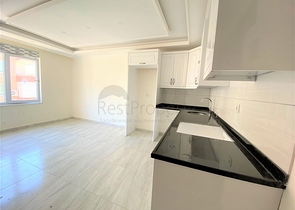 عقارات في الانيا - شقة جديدة من تصميم 1+1 - في مركز الانيا 