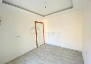 عقارات في الانيا - شقة جديدة من تصميم 1+1 - في مركز الانيا 