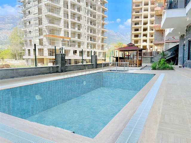 شقة 1+1 للبيع في حي محمودلار